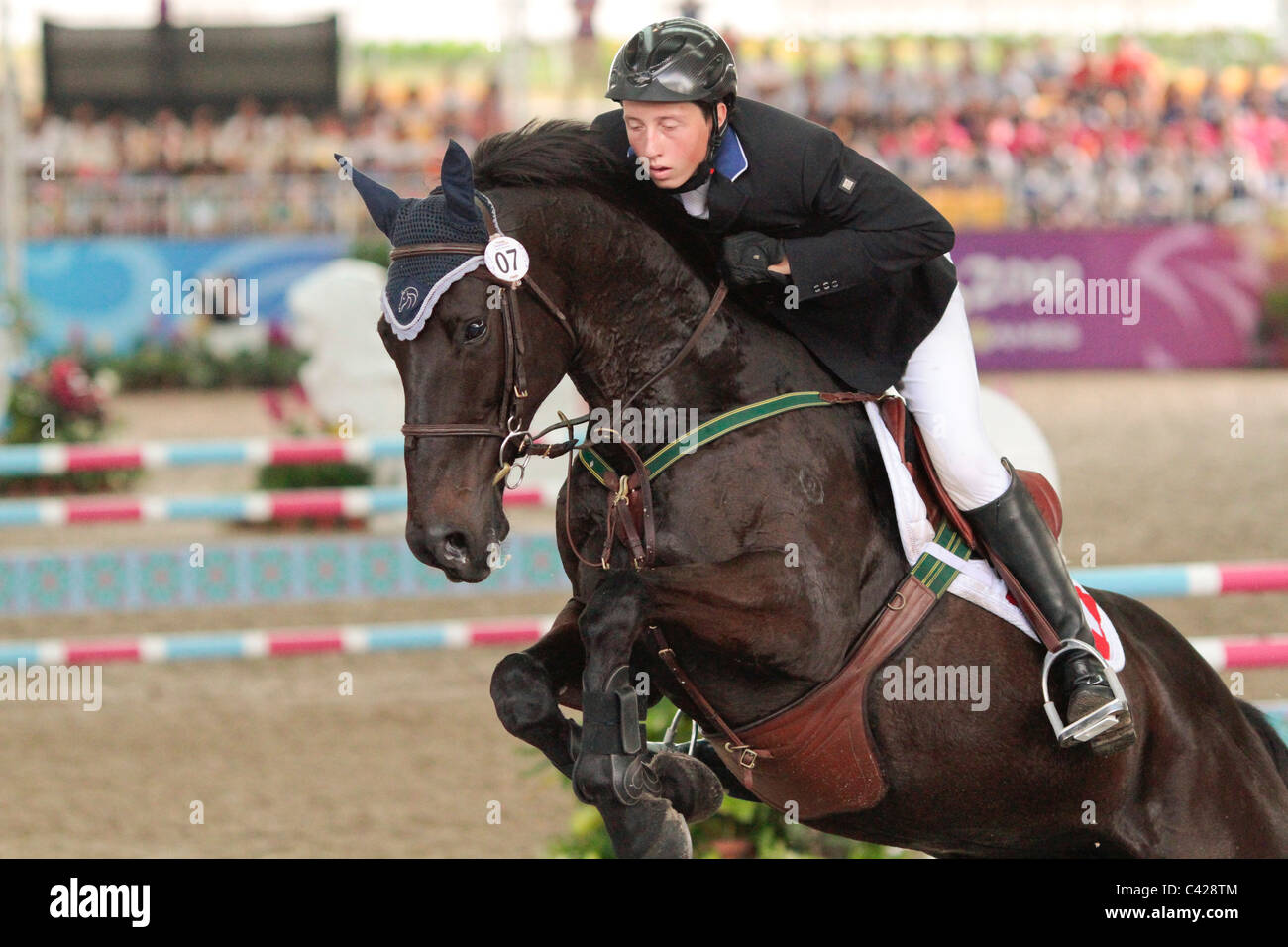 Martin Fuchs of Switzerland riding MIDNIGHT MIST during the Youth Olympic Games 2010 Equestrian Jumping Individual Round B. Stock Photo