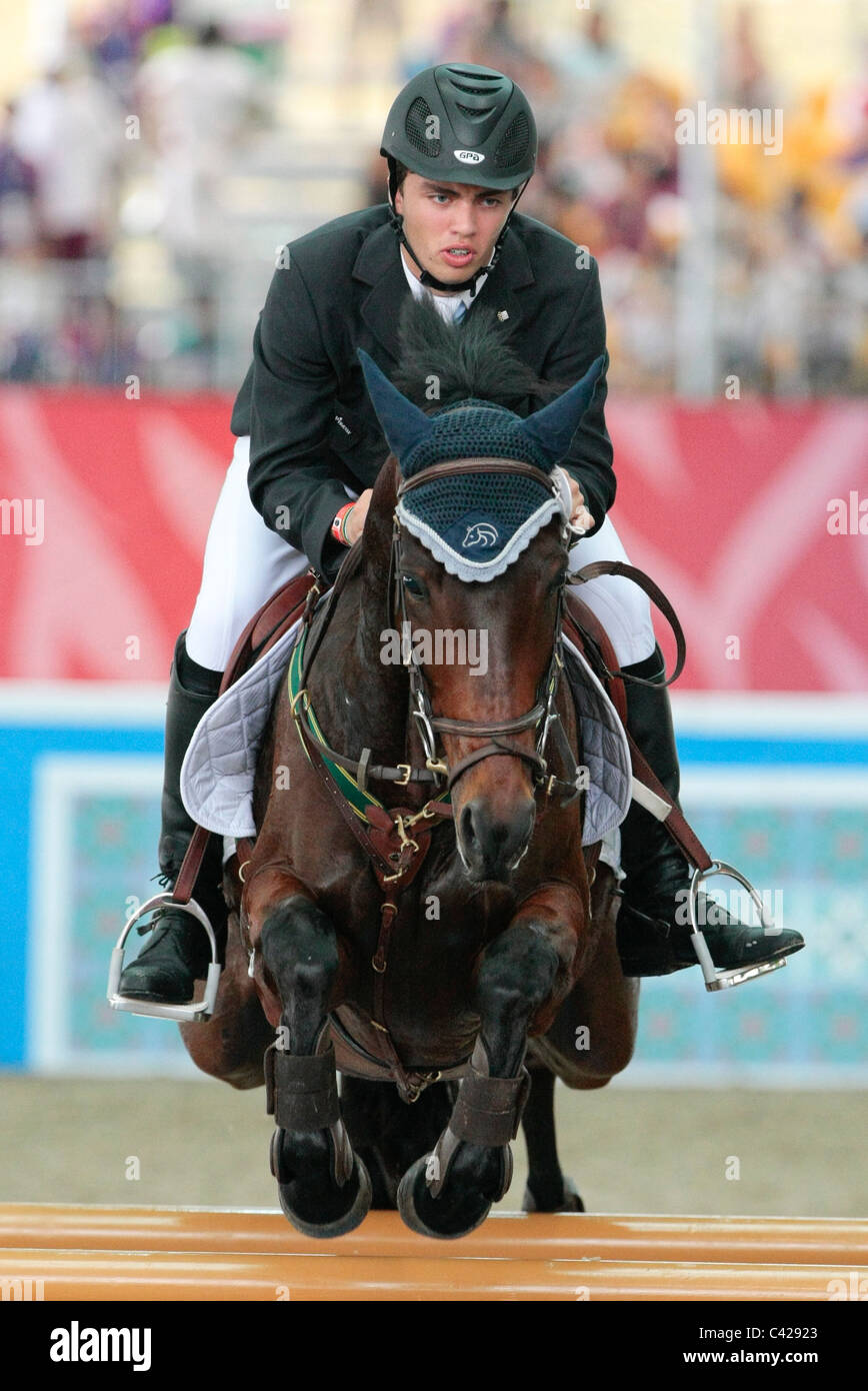 Marcelo Chirico of Uruguay riding LINKS HOT GOSSIP representing South America in the Youth Olympic Games Jumping Team Round 2. Stock Photo