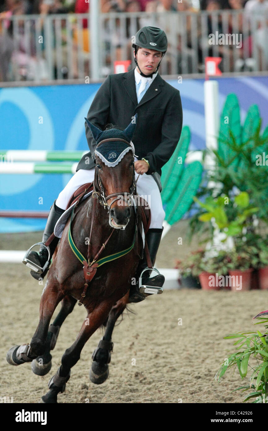 Marcelo Chirico of Uruguay riding LINKS HOT GOSSIP representing South America in the Youth Olympic Games Jumping Team Round 2. Stock Photo