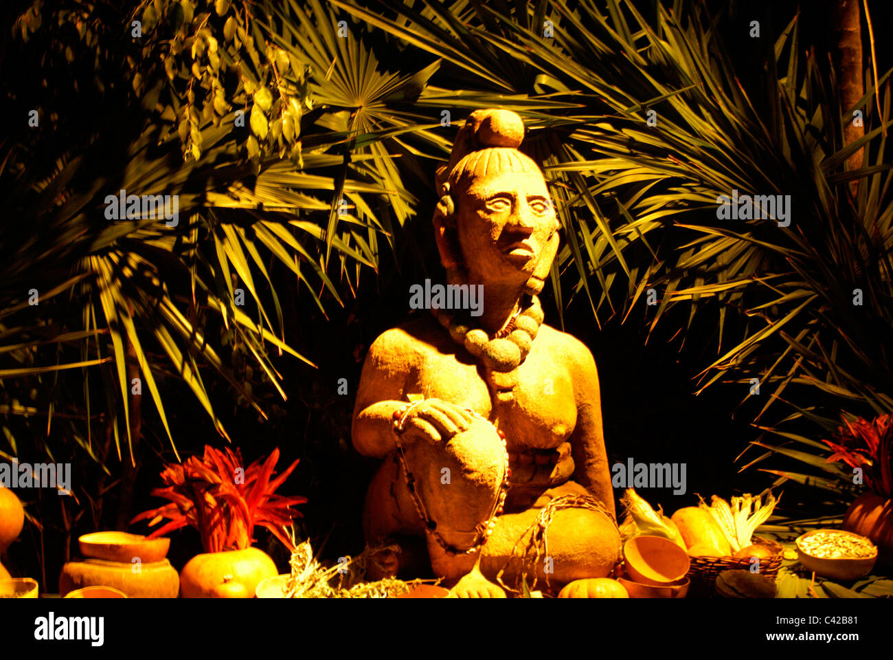 Statue of Ixchel, a Mayan fertility and moon goddess, surrounded by