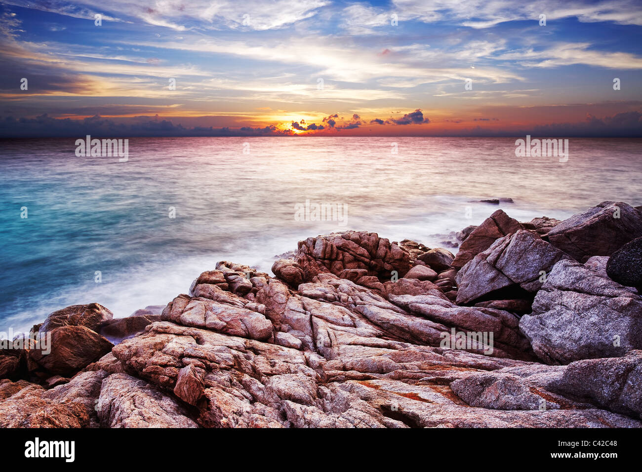 Sunset over the tropical bay. Long exposure shot. Stock Photo
