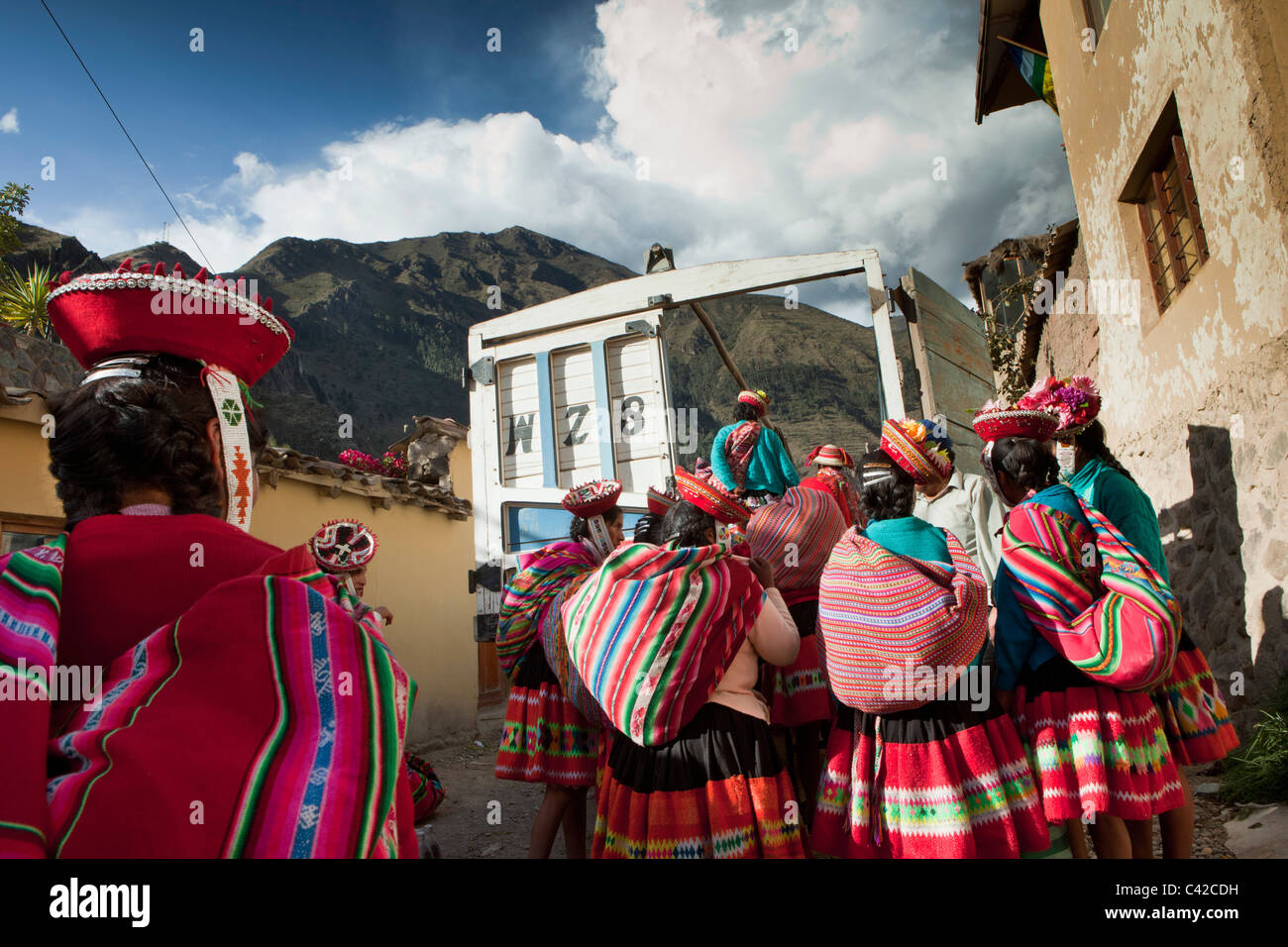Peru, Ollantaytambo, Indian People from Patacancha or Patakancha in their traditional dress boarding a truck to go home. Stock Photo