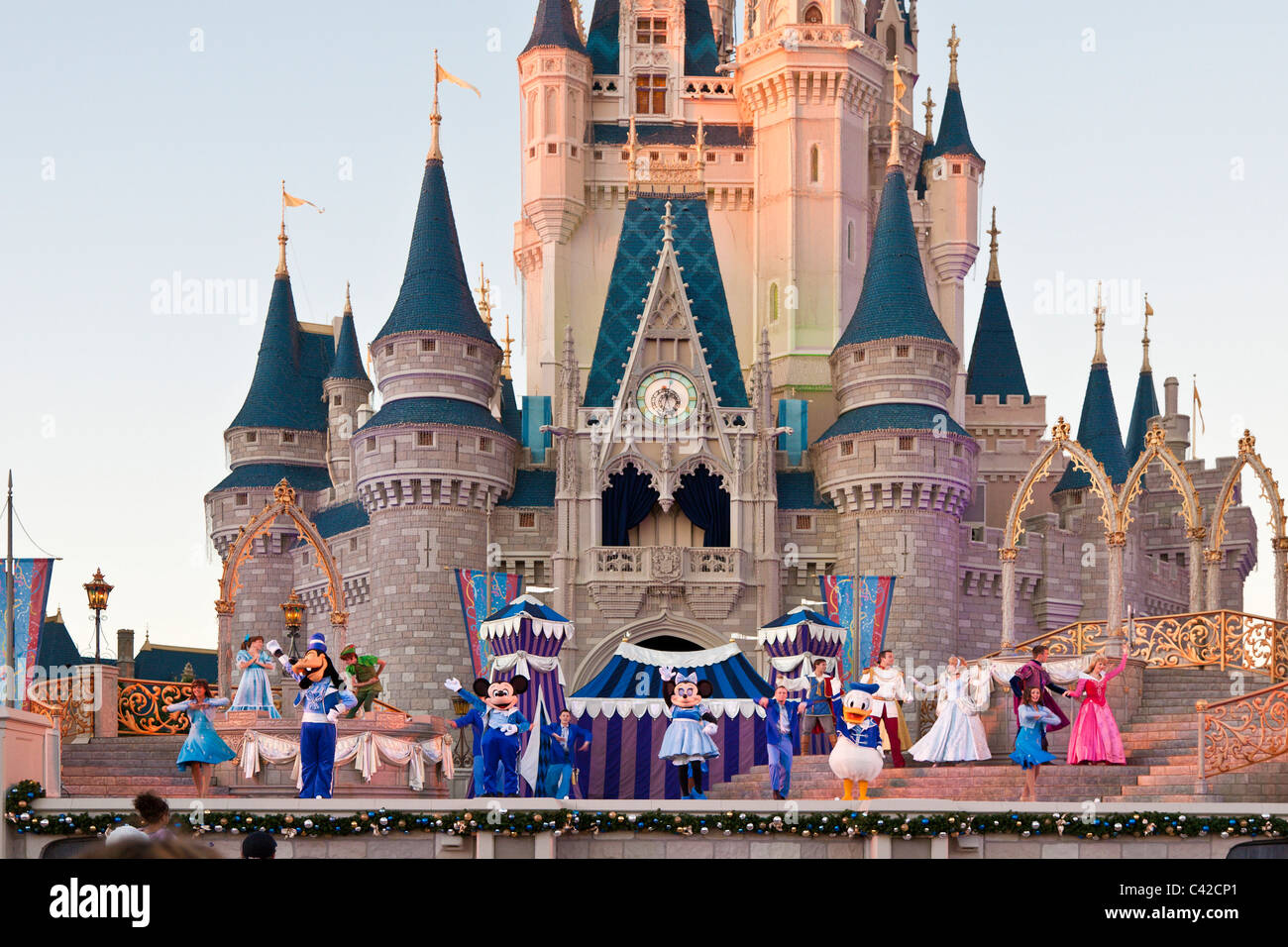 Show at Cinderella's castle features many Disney characters in costume at the Magic Kingdom in Disney World, Kissimmee, Florida Stock Photo