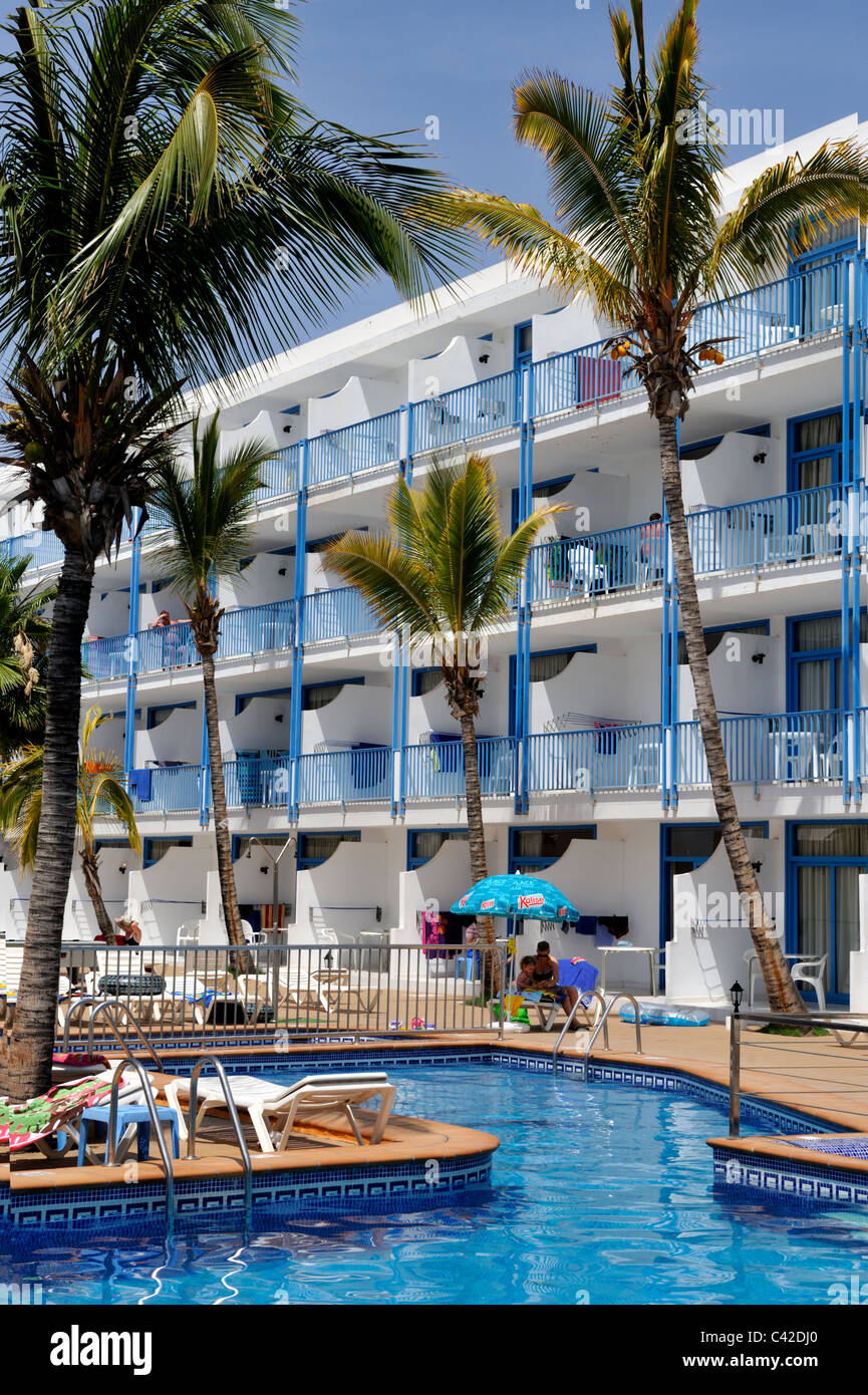 Swimming pool, balconies, palm tree of hotel apartments Puerto del Carmen, Lanzarote - 'Canary Islands' Stock Photo
