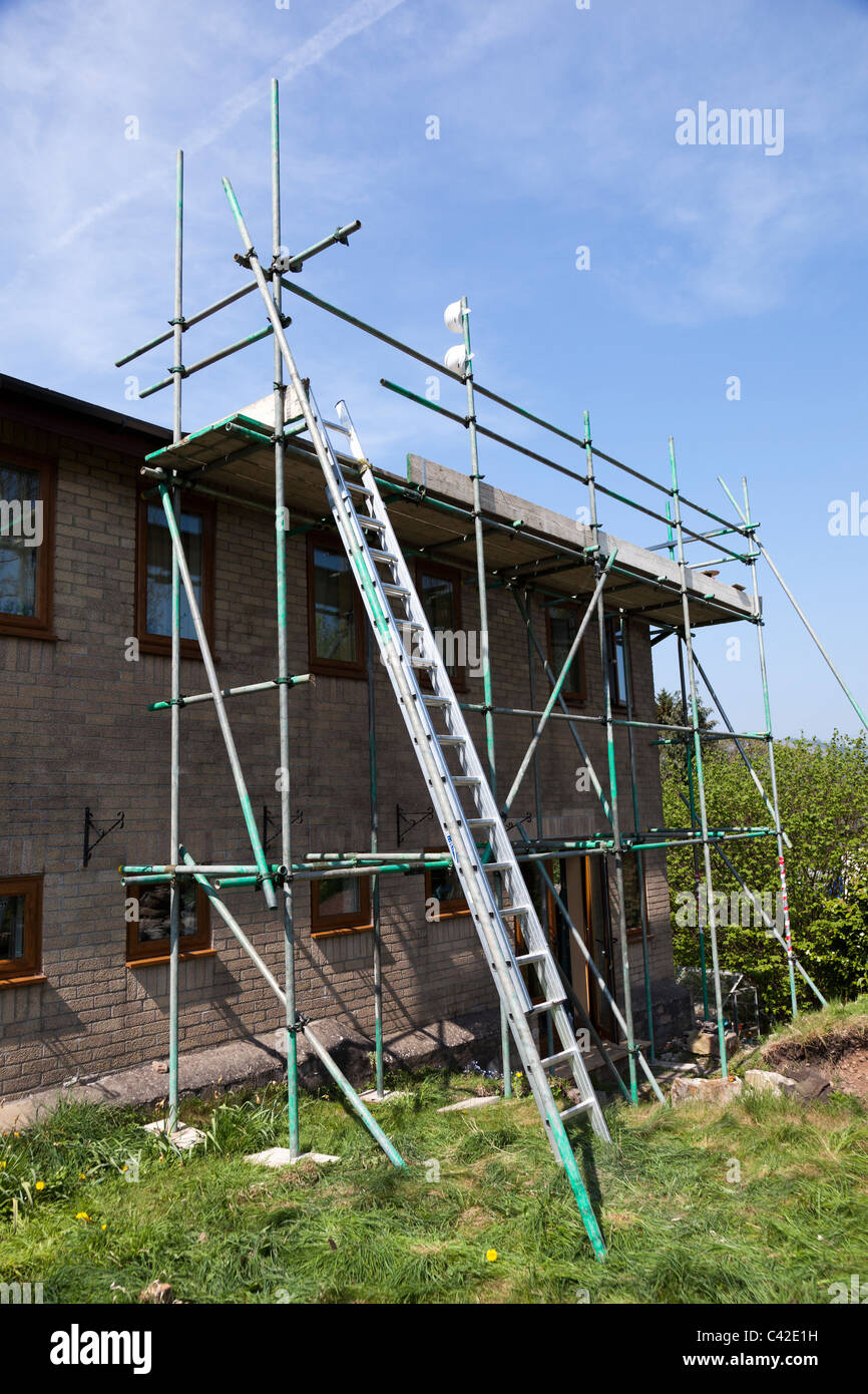 Scaffolding erected at side of house Wales UK Stock Photo Alamy