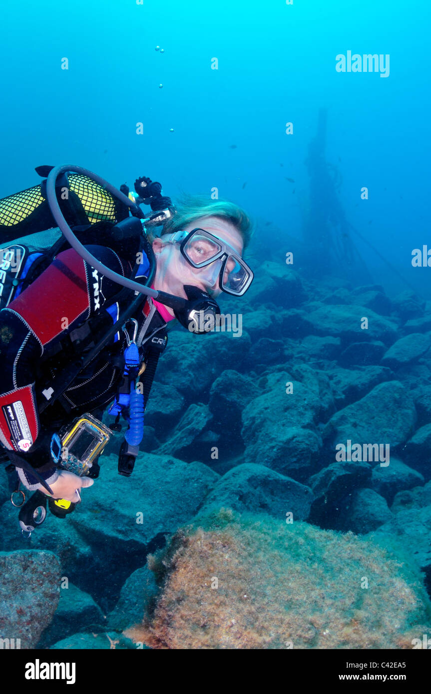 Woman scuba diver underwater Stock Photo