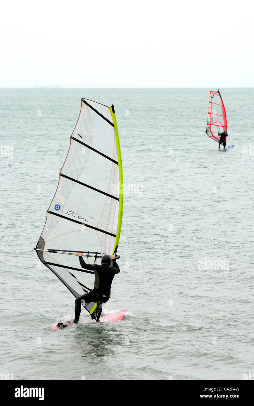 2 men windsurfing england uk Stock Photo Alamy