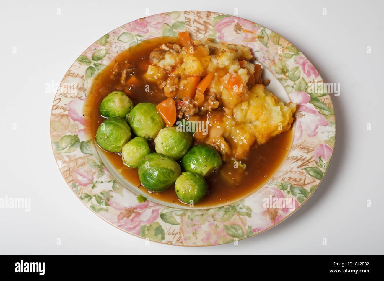 Sheperds pie with Brussel sprouts Stock Photo