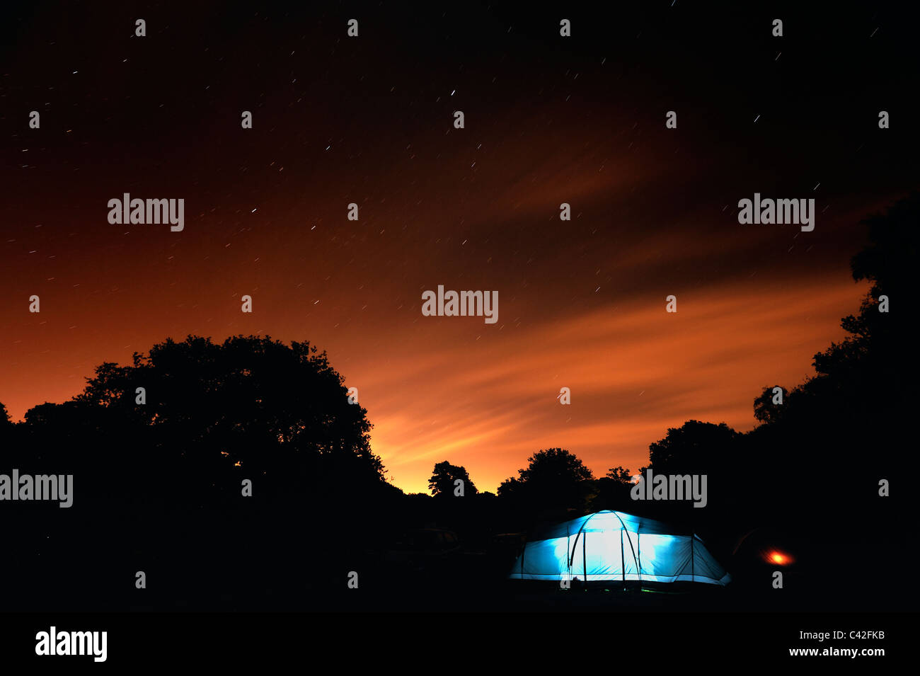 Camping under a starry sky Stock Photo - Alamy