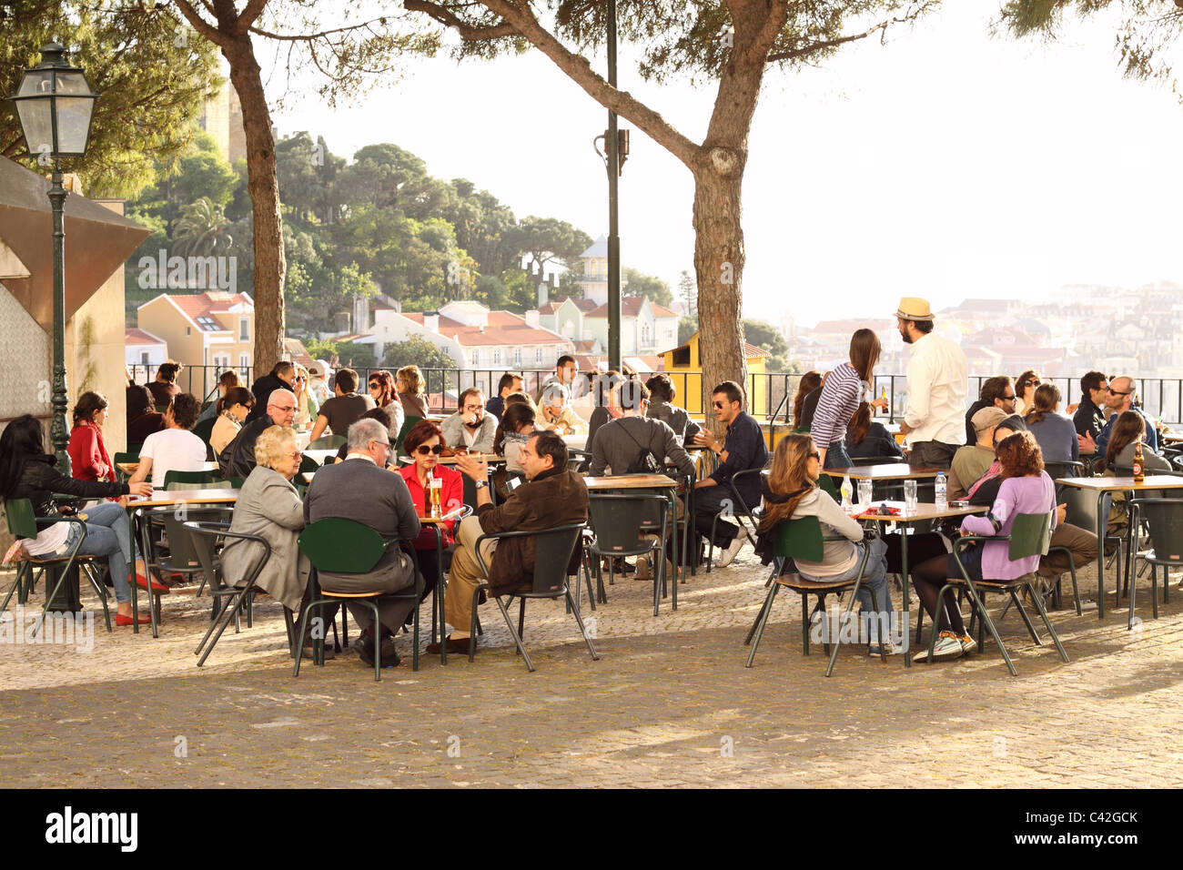 Lisbon Portugal the Miradouro da Graca viewing terrace open air cafe in the evening Stock Photo