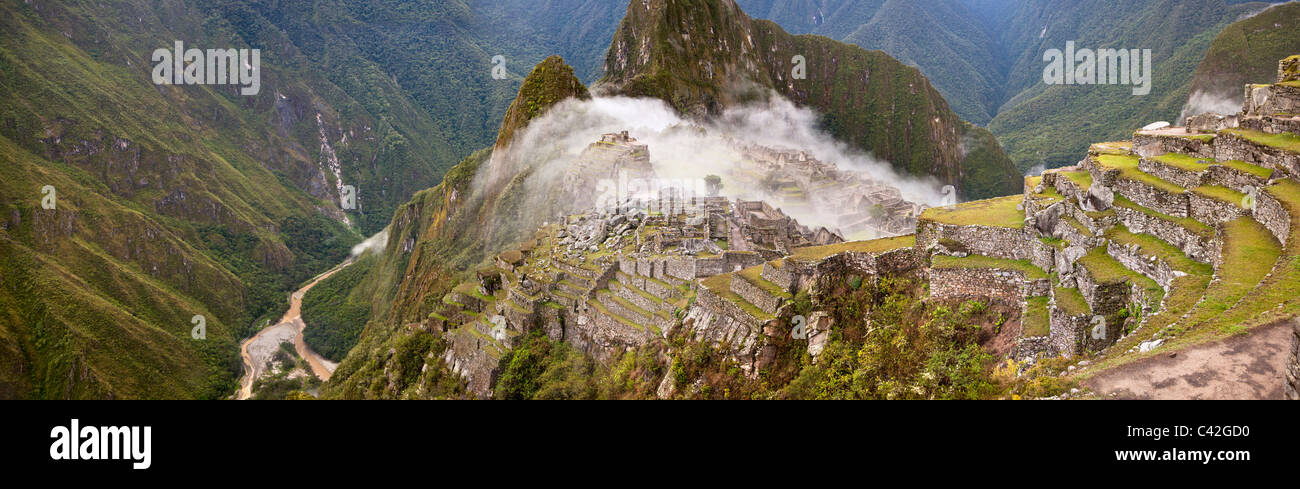 Peru, Aguas Calientes, Machu Picchu. 15th-century Inca site located 2,430 metres (7,970 ft) above sea level. Panoramic view. Stock Photo