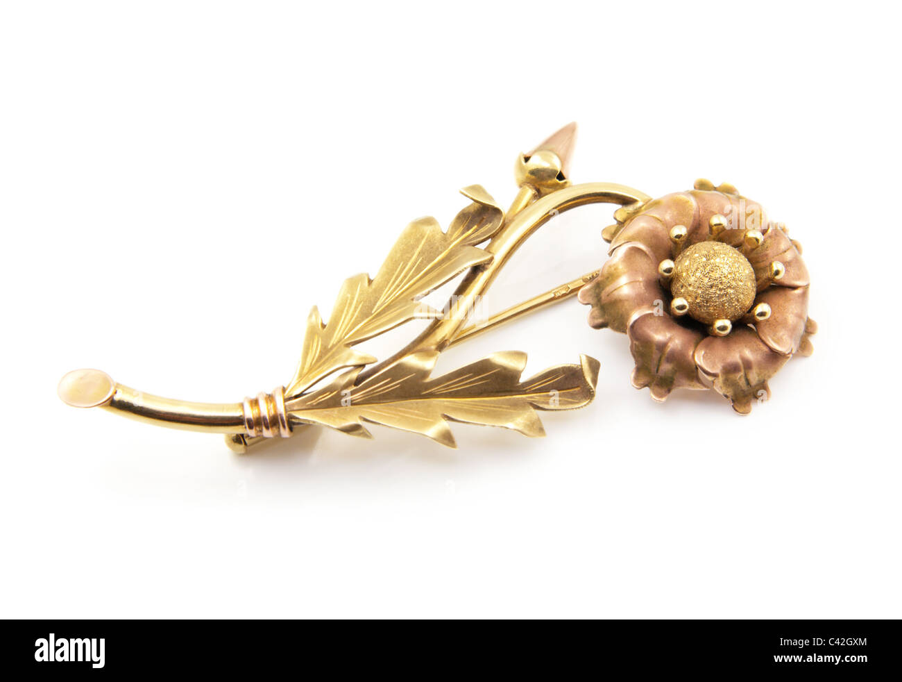 Gold brooch on white background Stock Photo - Alamy