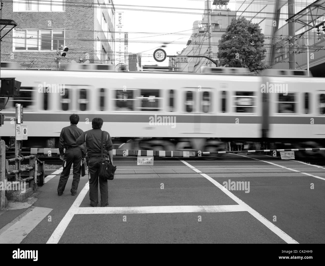 Railway crossing in Shinjuku, Tokyo Stock Photo