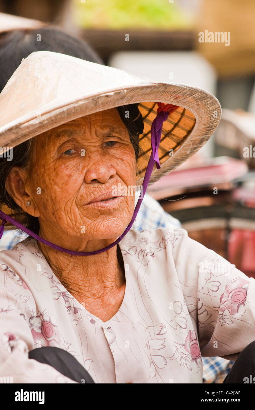Old lady wearing Non La hat in market Stock Photo