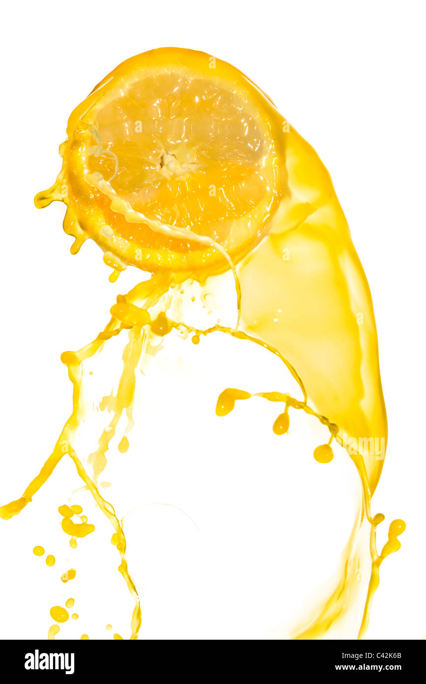 orange juice splash isolated on white background Stock Photo - Alamy