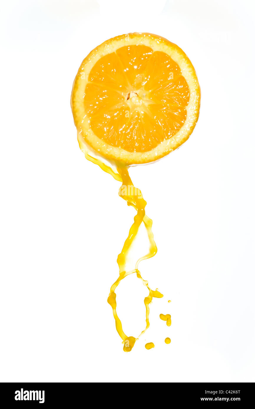 orange juice splash isolated on white background Stock Photo - Alamy