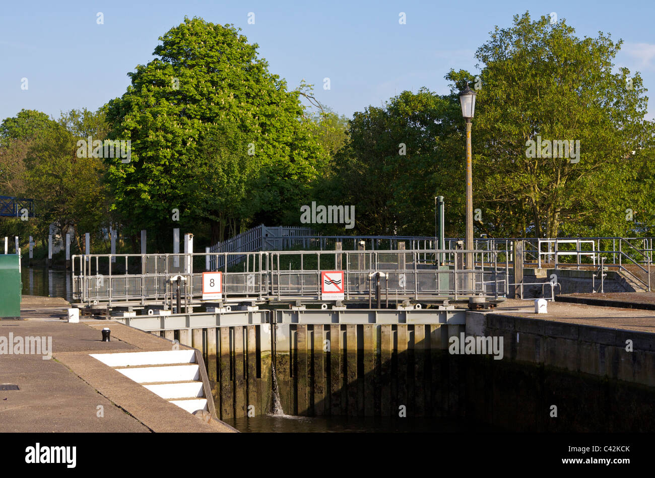 The closed lock gates at Teddington Lock on the river Thames in Middlesex, after a boat has departed downstream Stock Photo
