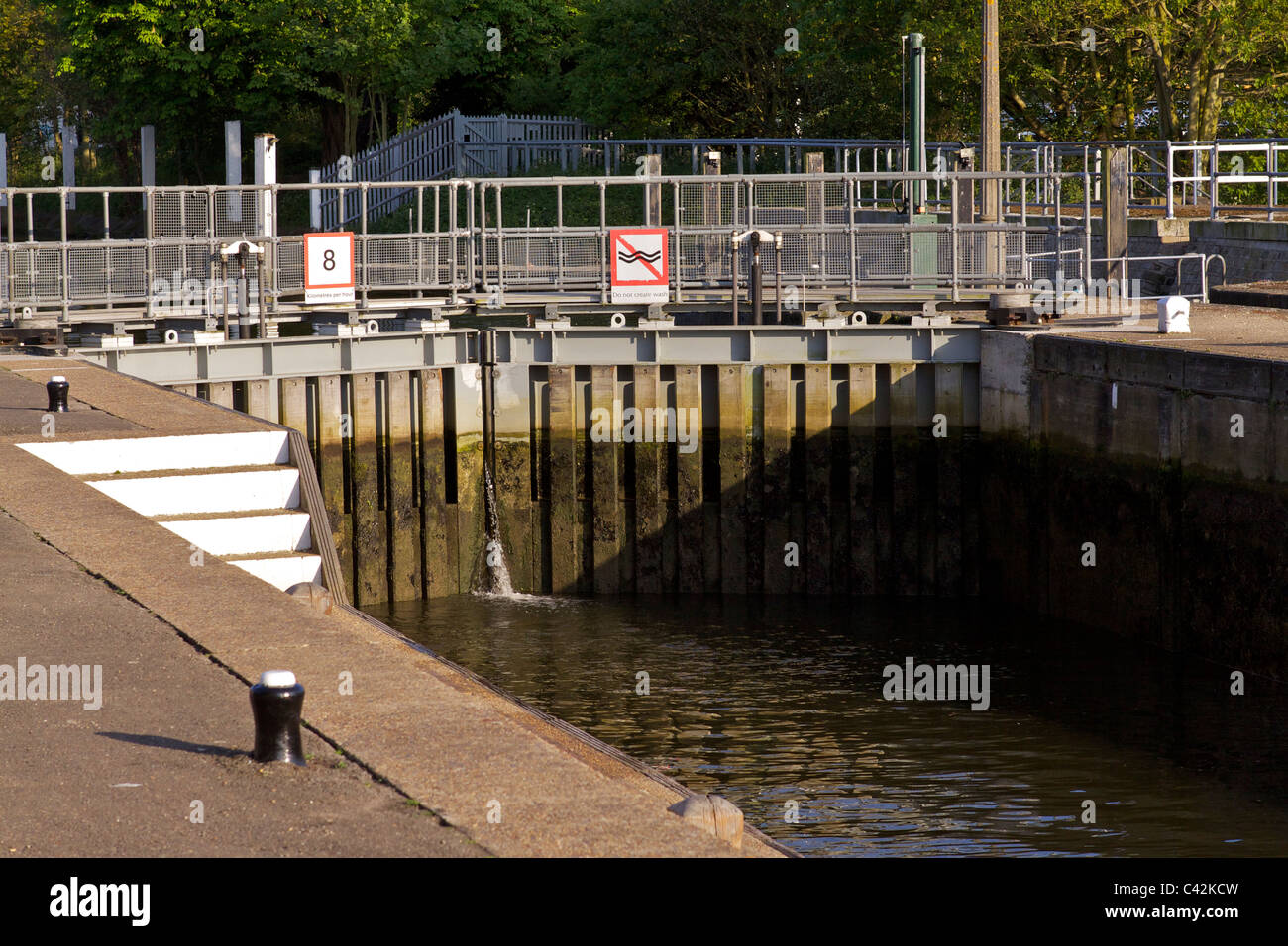 The closed lock gates at Teddington Lock on the river Thames in Middlesex, after a boat has departed downstream Stock Photo