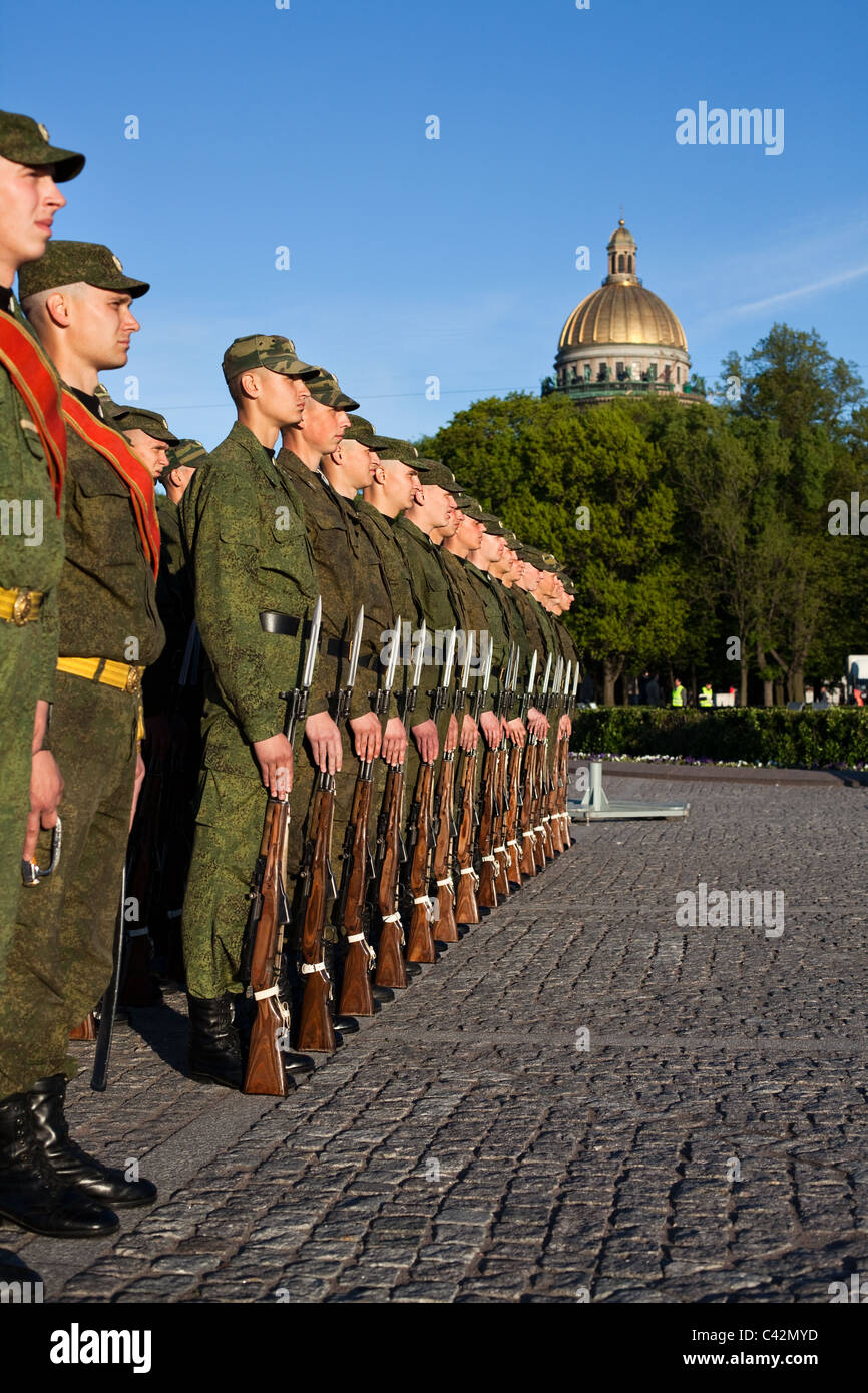 Military parade and soldiers with Russian flag and arms in line.  Saint-Petersburg, Russia Stock Photo