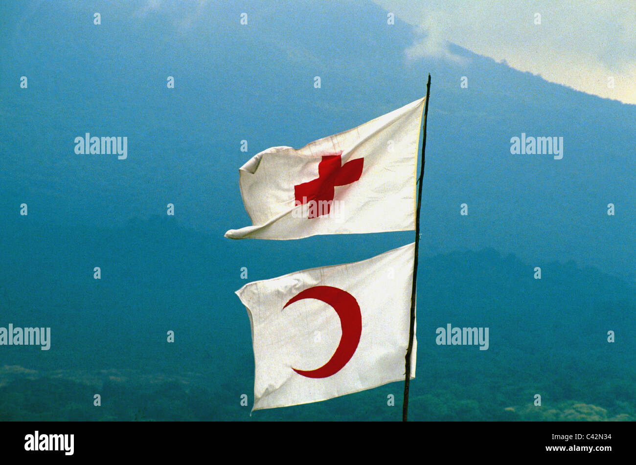 Flags of International Red Cross and Red Crescent fly over Kibumba camp for Rwandan refugees. Goma, Zaire - Congo Stock Photo