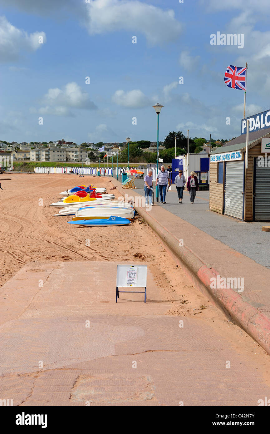 holidaymakers walking along seafront path goodrington sands beach devon