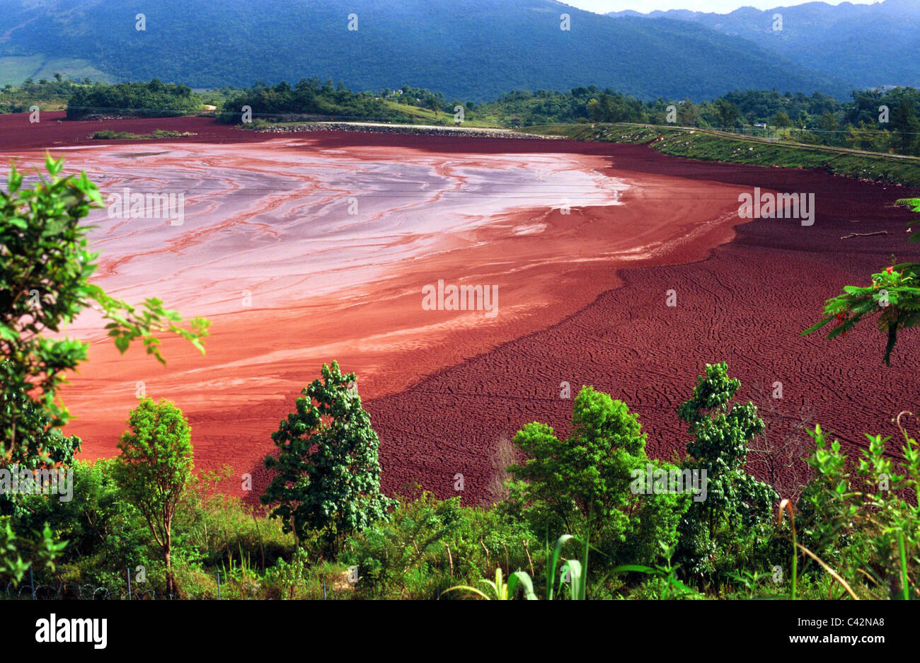 Run off waste at foreign owned Bauxite mine, raw material for aluminium