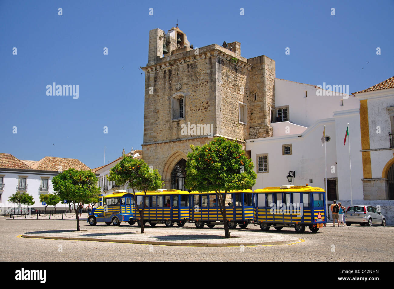 Tourist train passing Faro Cathedral, Largo da Se, Old Town, Faro, Algarve Region, Portugal Stock Photo