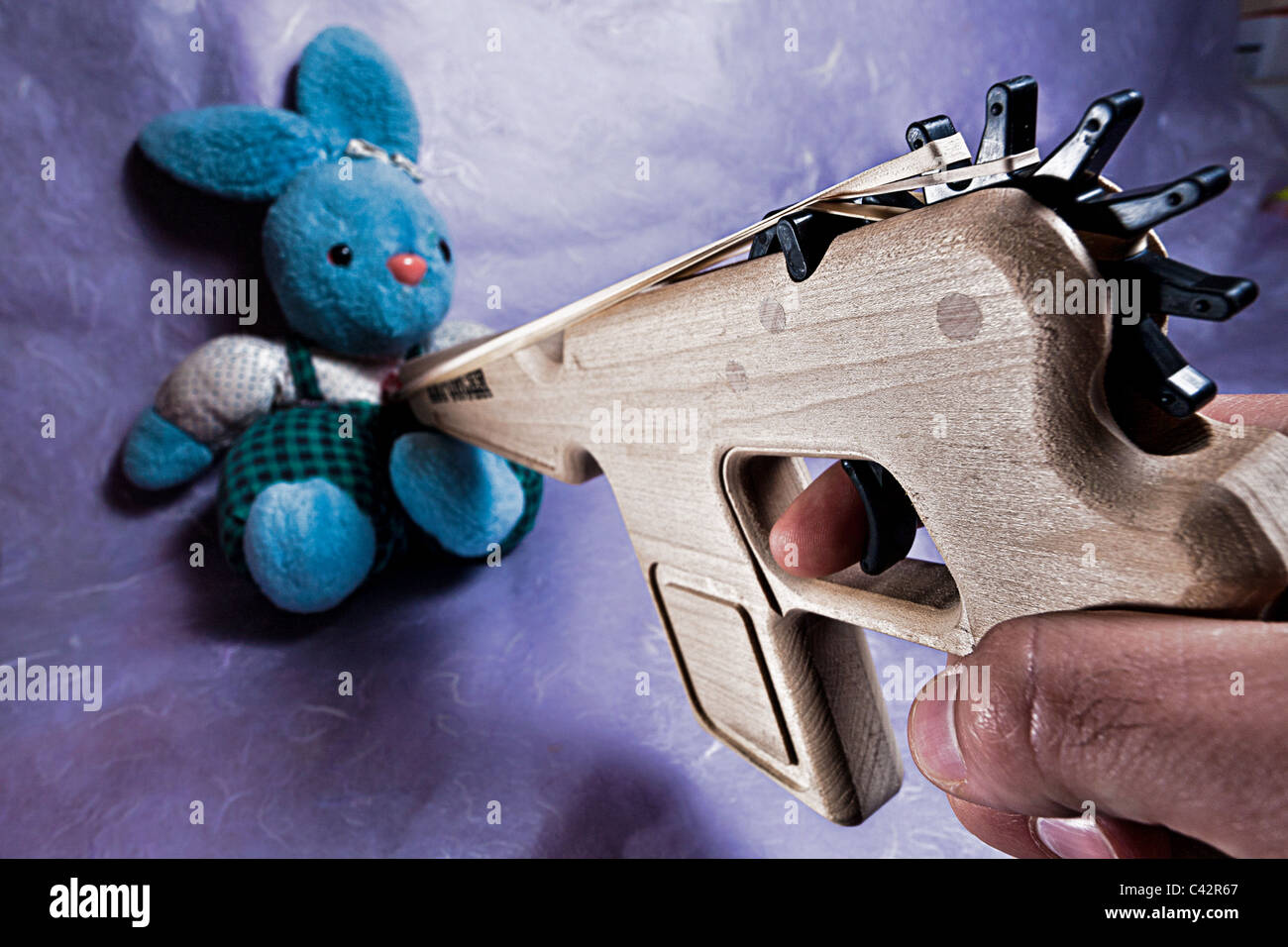 Toy Gun and Stuffed Bunny Stock Photo Alamy