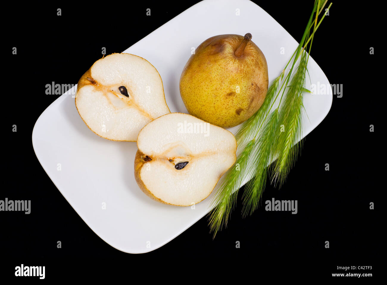 fresh juicy pears and green ears of wheat Stock Photo
