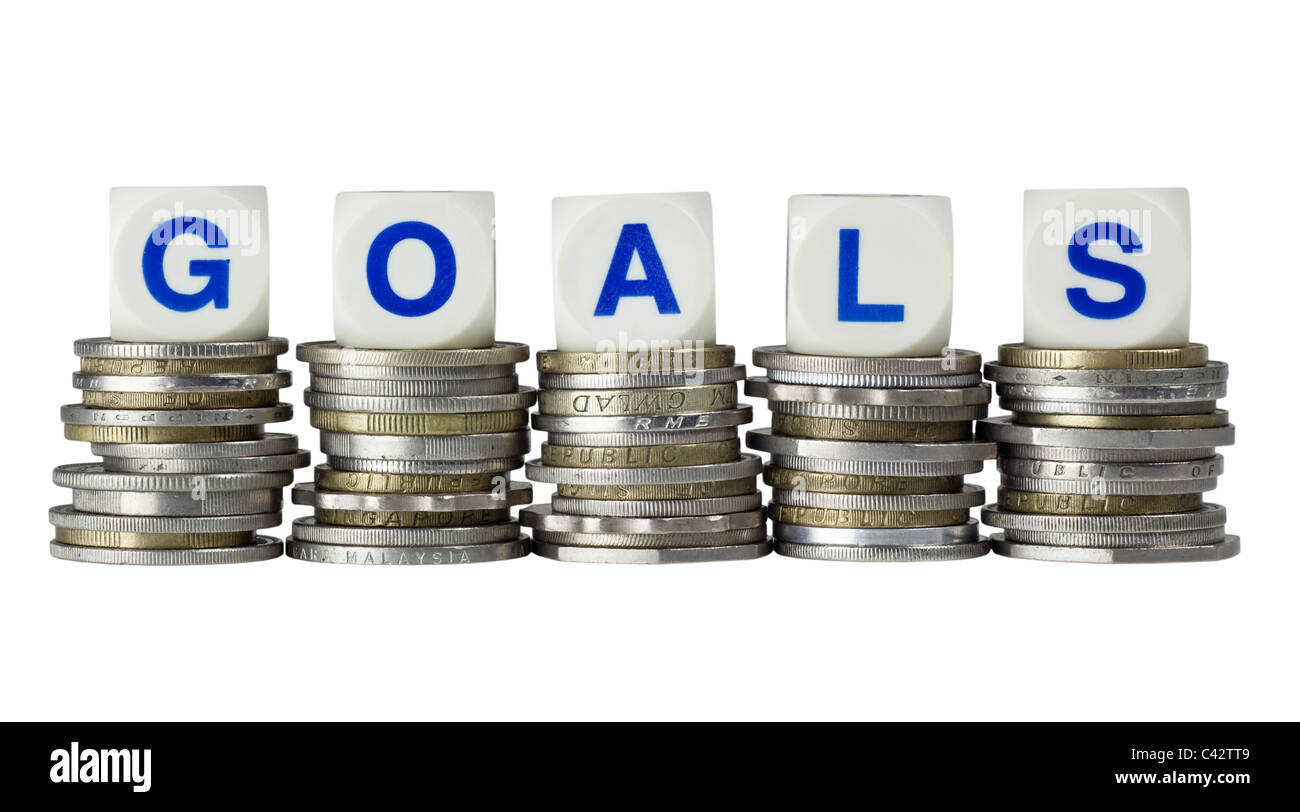 Stacks of coins with the word GOALS isolated on white background Stock ...