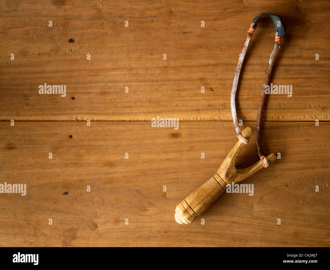 Slingshot wooden background Stock Photo