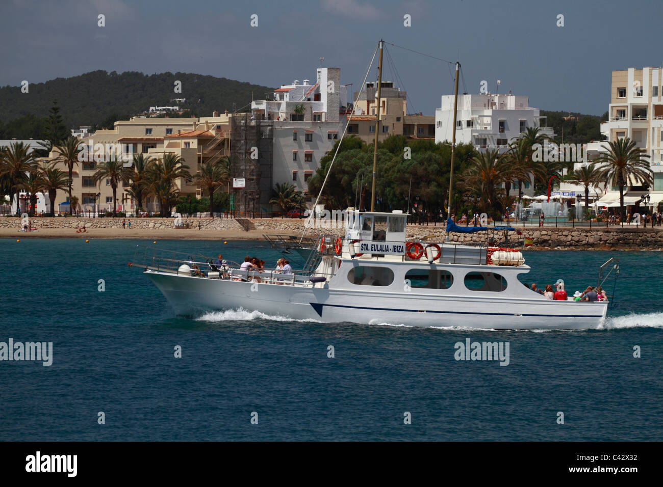 Ferryboat crossing the bay of Santa Eulalia, Ibiza, Spain Stock Photo