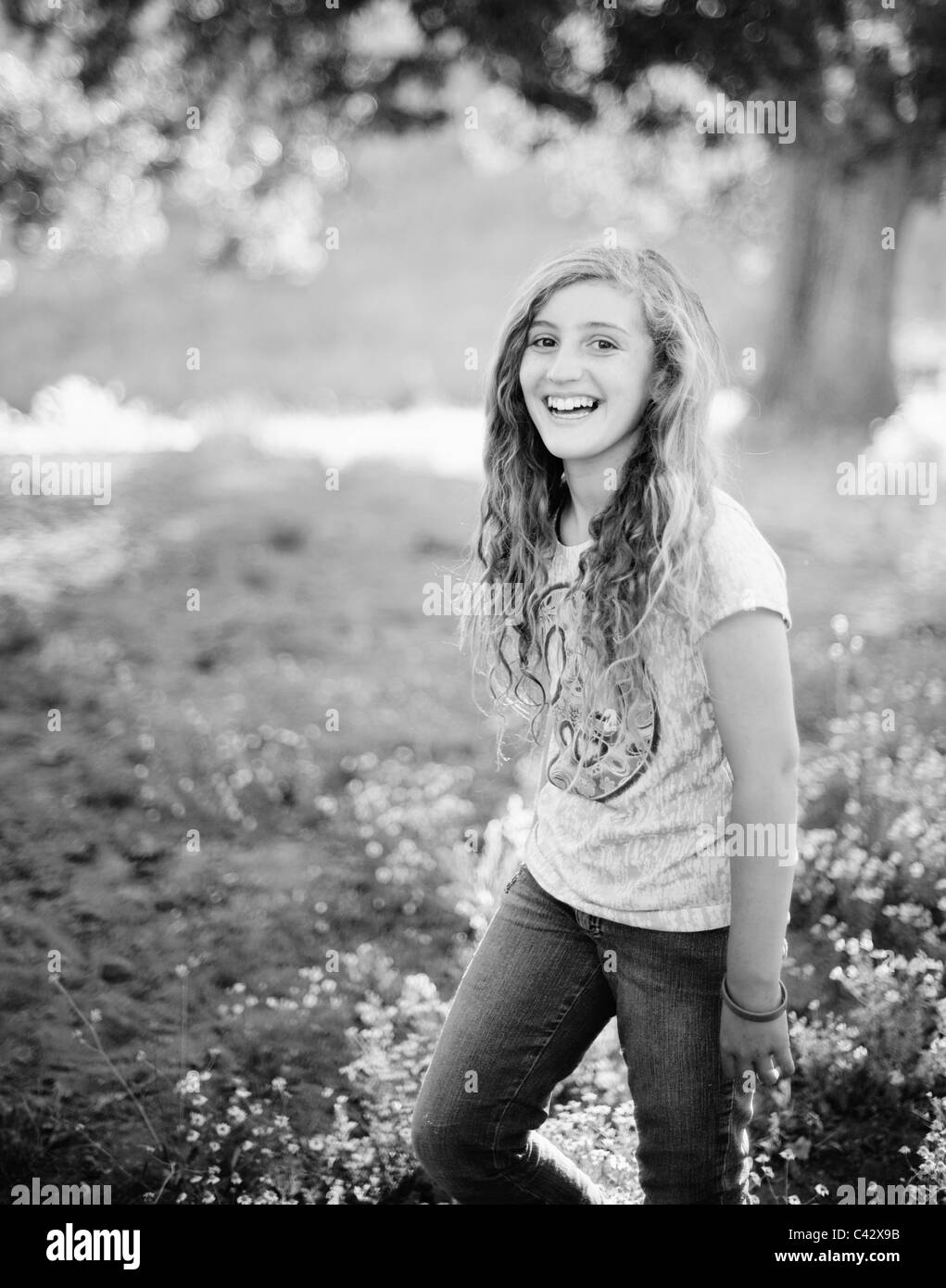 Young girl smiles for natural light black and white portrait Stock Photo -  Alamy, image size:1021x1390