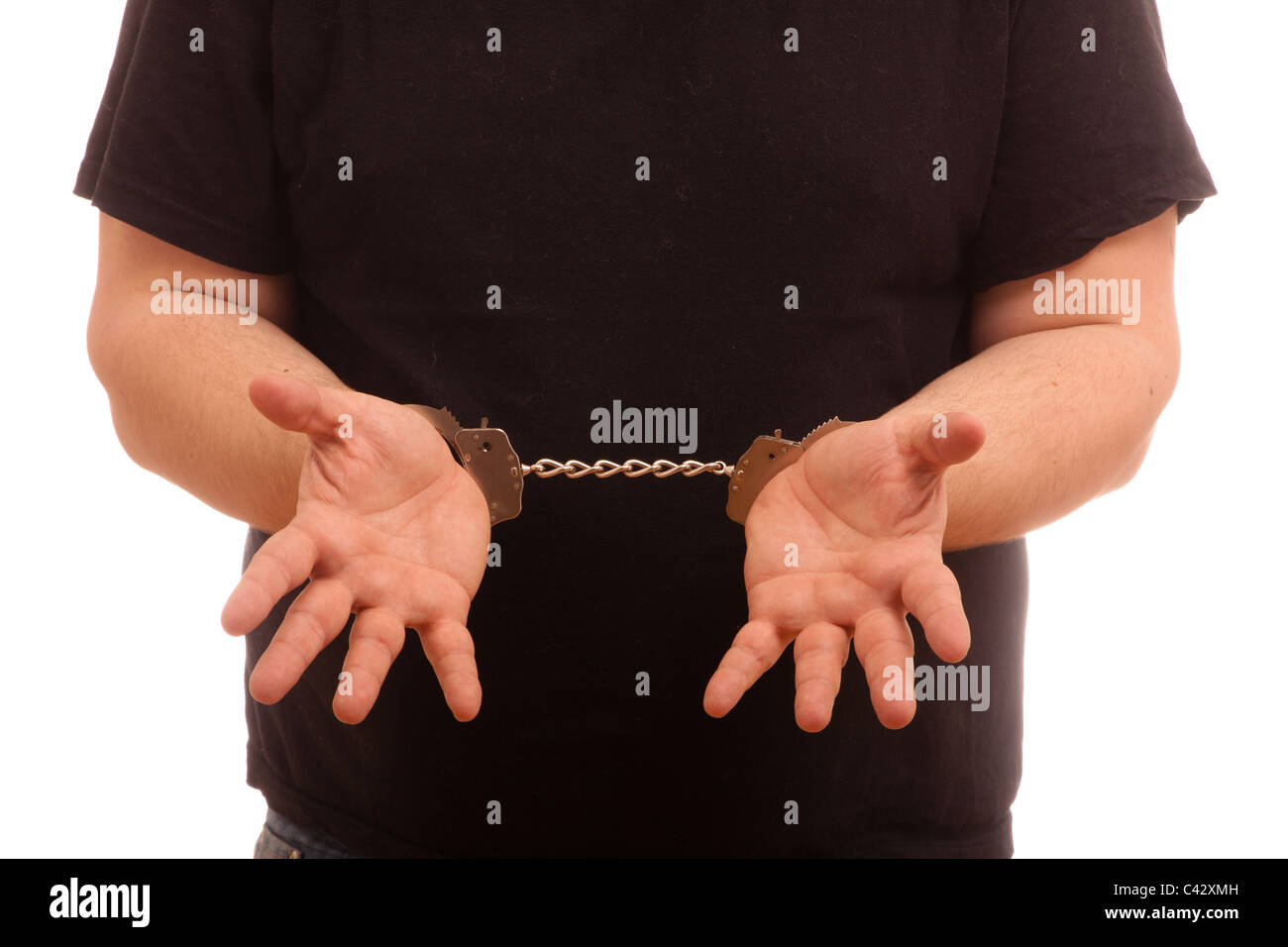 Man on handcuffs showing hands Stock Photo
