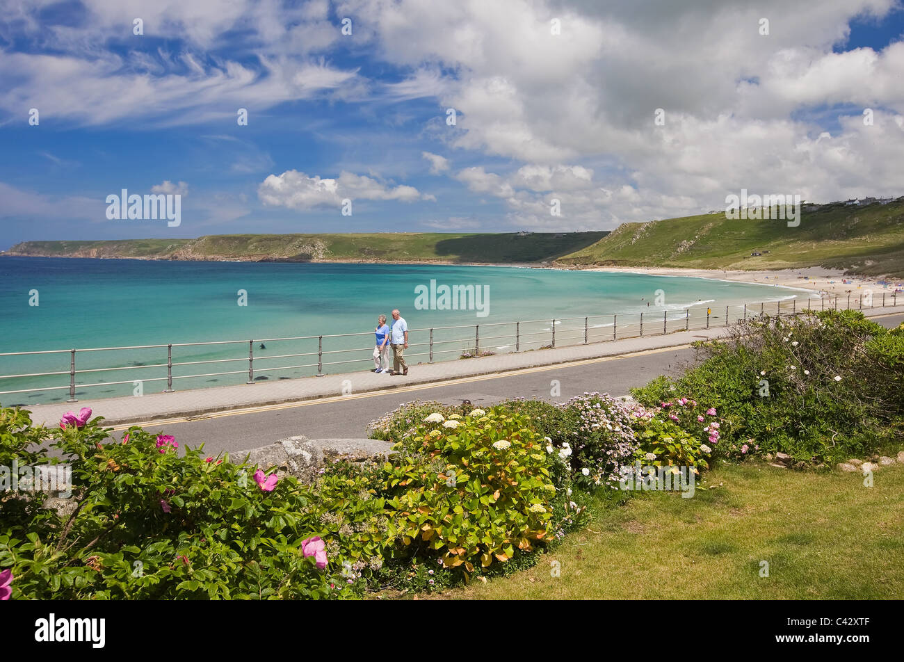 Promenade walkers at Sennen Cove, West Cornwall, England, UK Stock Photo