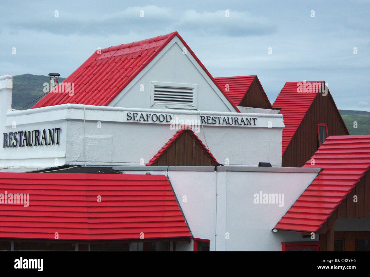 Red roofs and white walls of a seafood restaurant in Fort William, Scotland, UK Stock Photo