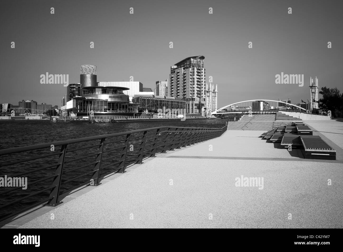 The Lowry, Millennium Bridge and apartments, taken from outside the Imperial War Museum, Salford Quays, Manchester, UK Stock Photo