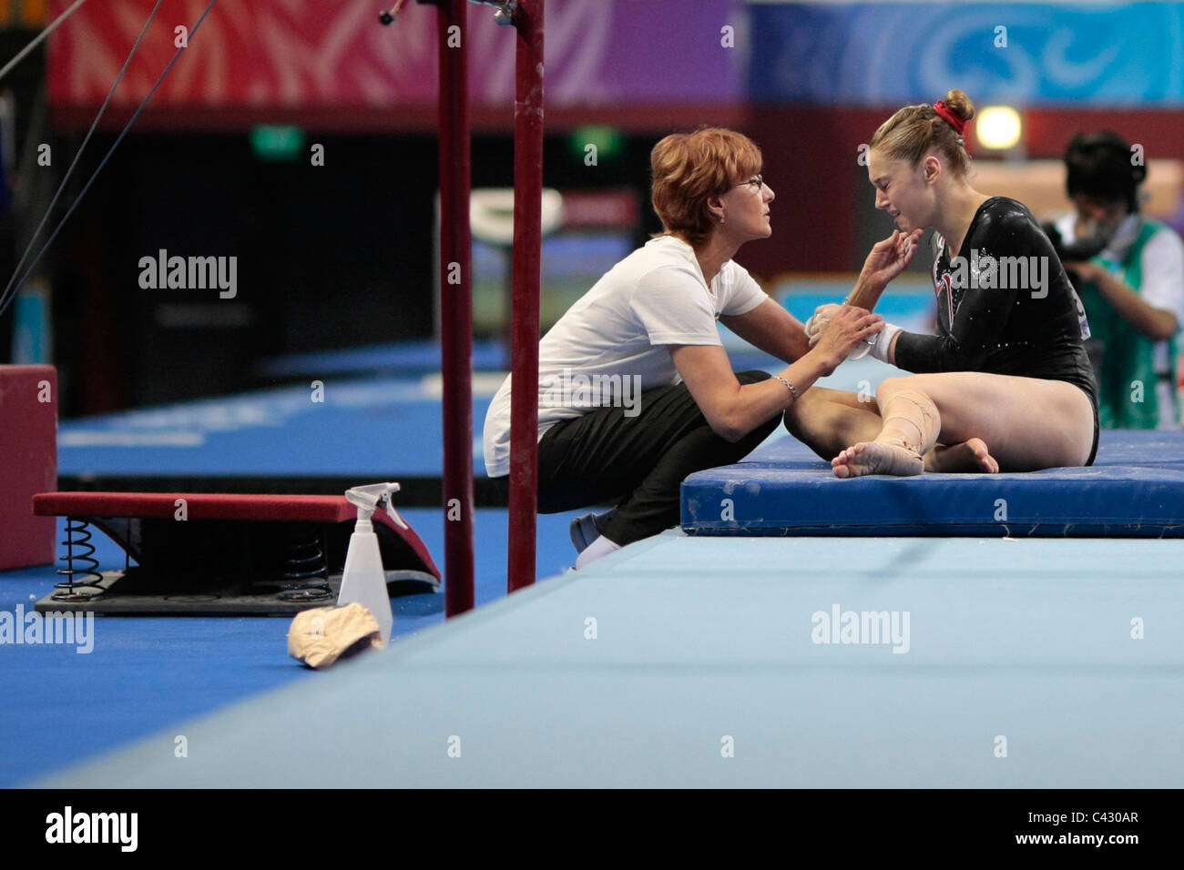The Canadian Gymnastics Coach(left) tries to calm down Madeline