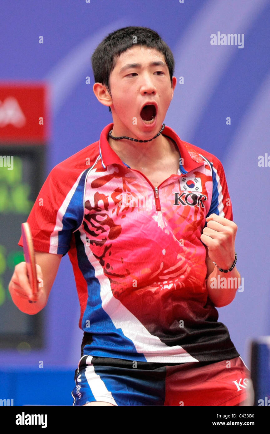 Kim Dong Hyun of Team Korea competing in the 2010 Singapore Youth Olympic Games Table Tennis Mixed Team Finals. Stock Photo
