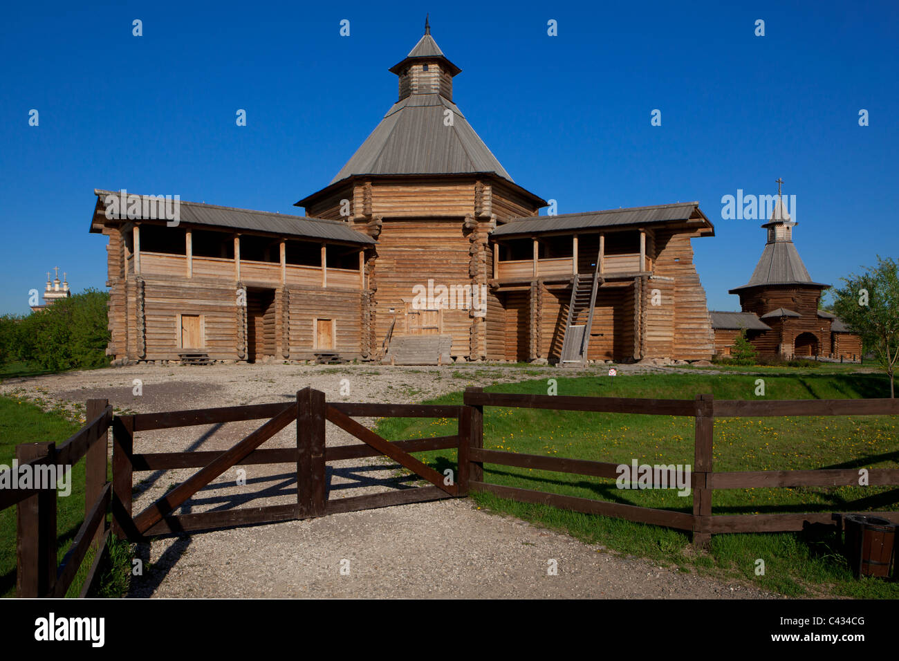 The wooden Bratsk Stockade Tower and the Monastery of Saint Nicholas at the Museum of Wooden Architecture at Kolomenskoye in Moscow, Russia Stock Photo