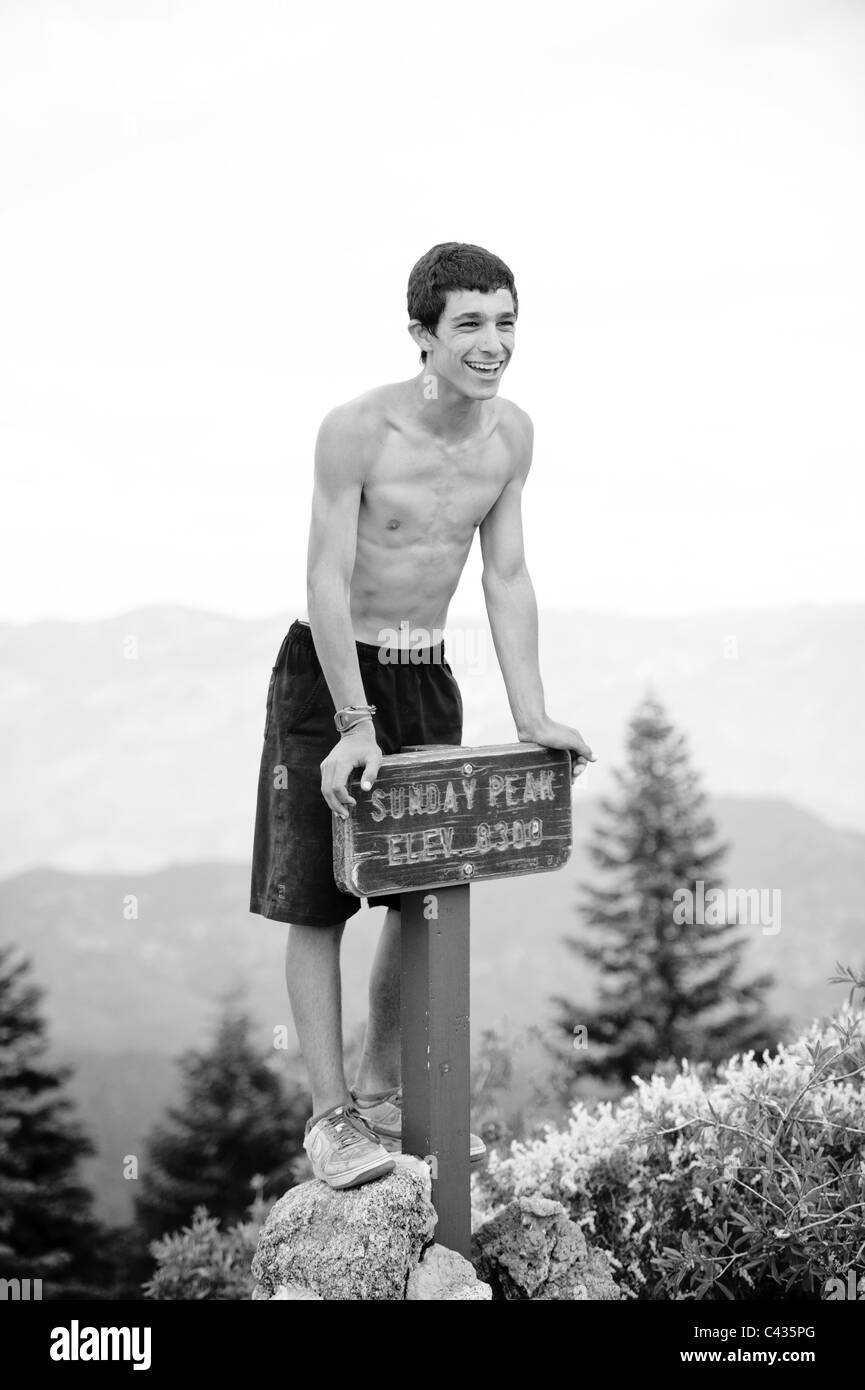 Teenage boy at top of mountain Stock Photo - Alamy