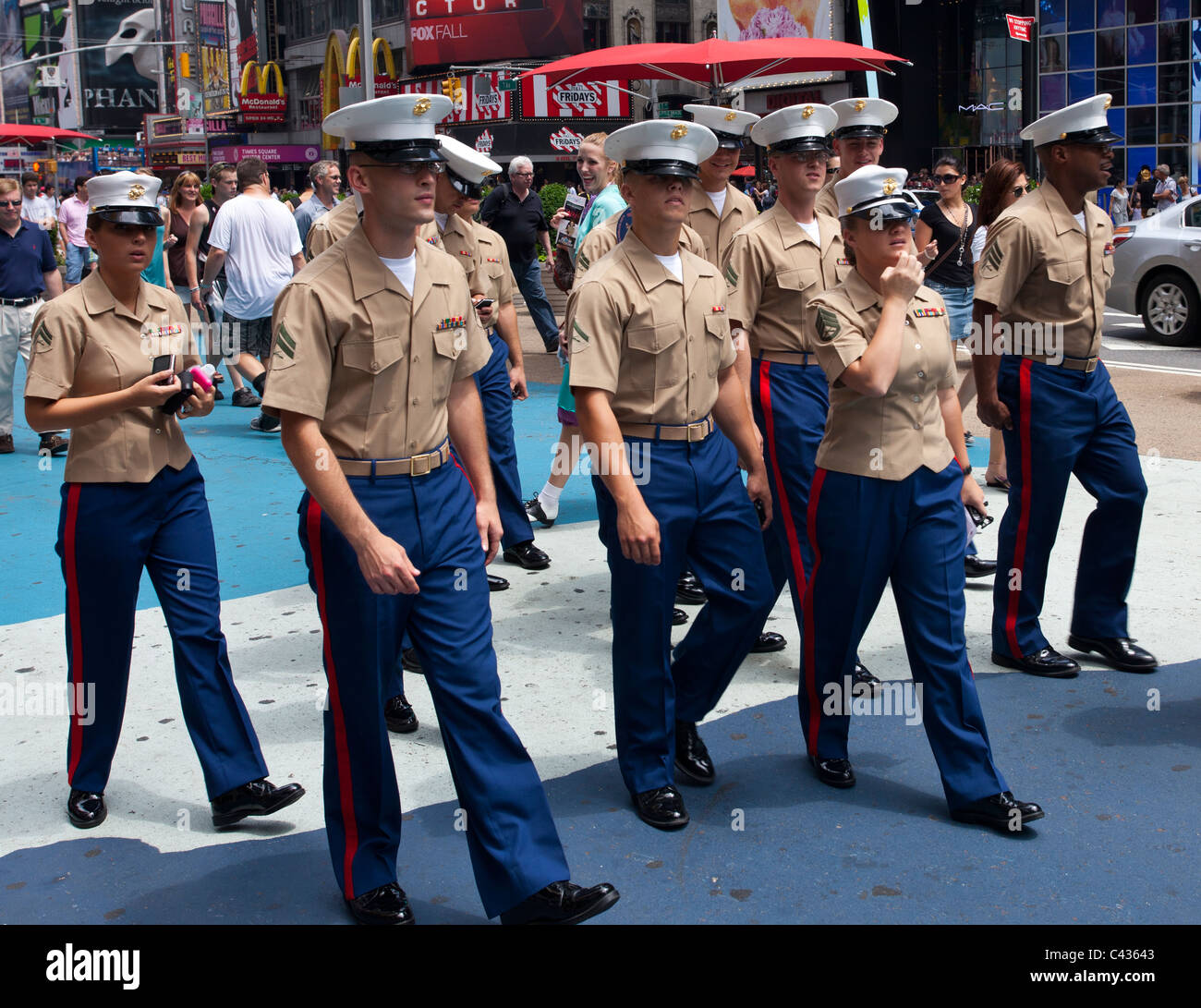 United States Marine Corps armed forces personnel in uniform on leave, Times Square, New York City, USA Stock Photo
