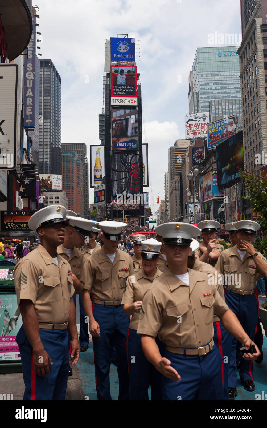 United States Marine Corps armed forces personnel in uniform on leave, Times Square, New York City, USA Stock Photo