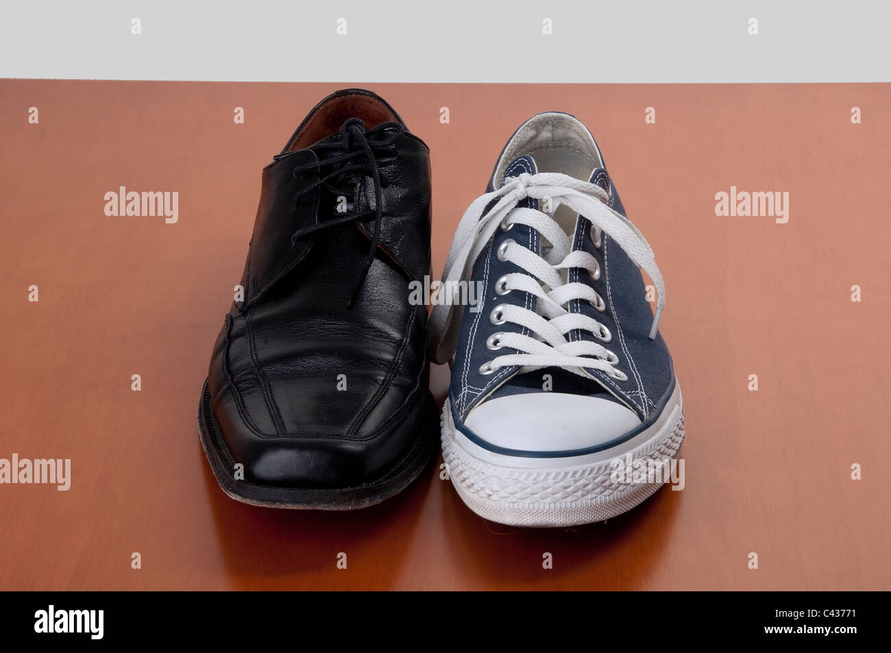 the contrast between a classic shoe and a sports shoe Stock Photo - Alamy