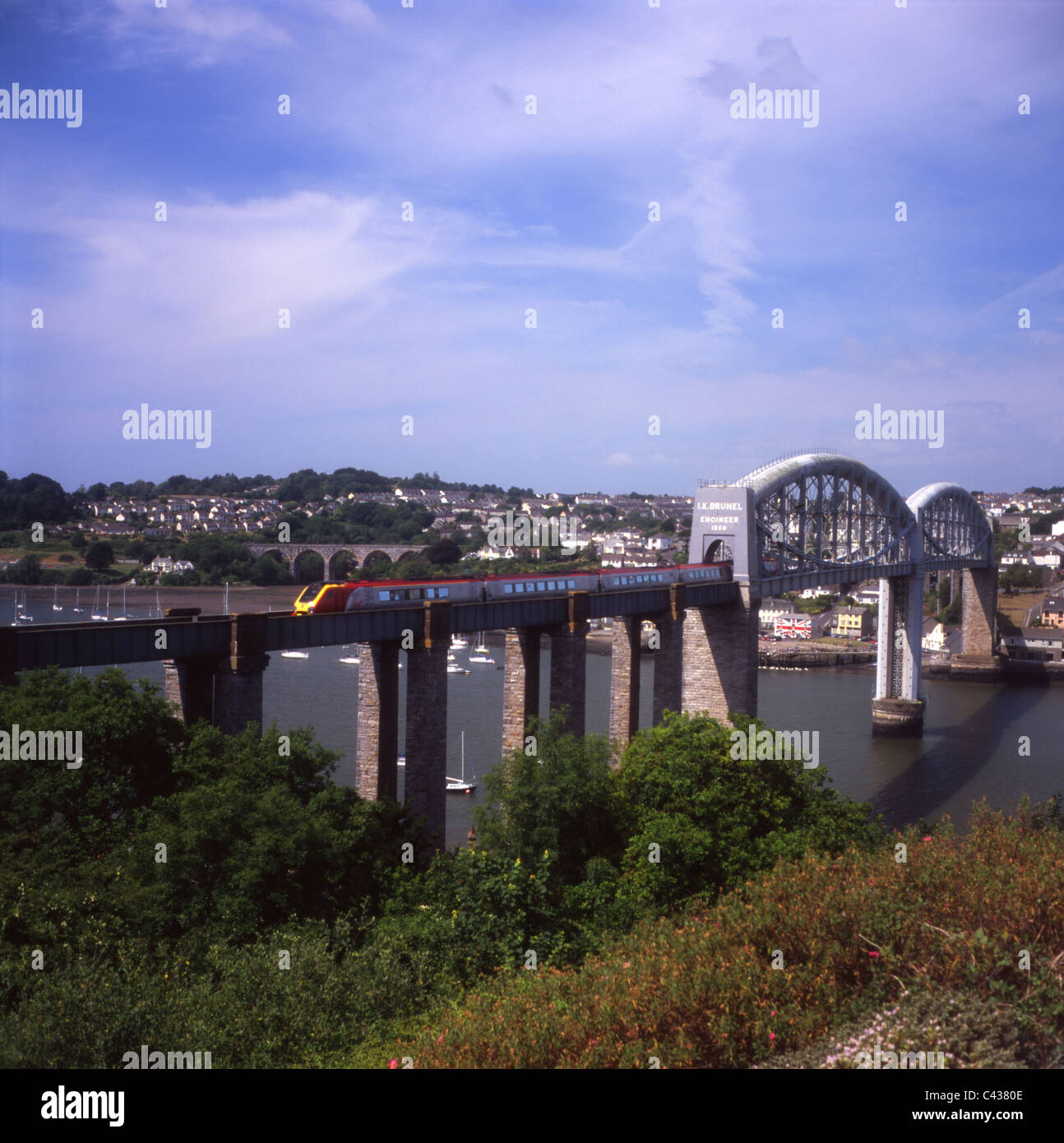 Virgin Voyager crosses the River Tamar on Brunel's famous Royal Albert Bridge which spans the border between Devon and Cornwall. Stock Photo