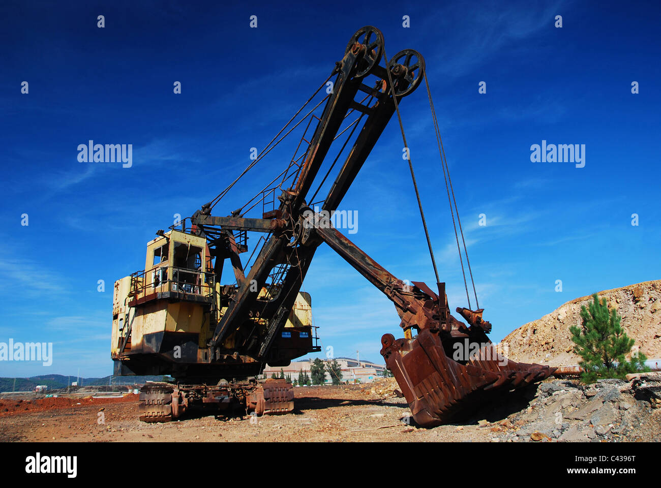Mining big machines backhoe - bulldozer working in old development. Part of the Route of Industrial Culture Riotinto, Spain Stock Photo