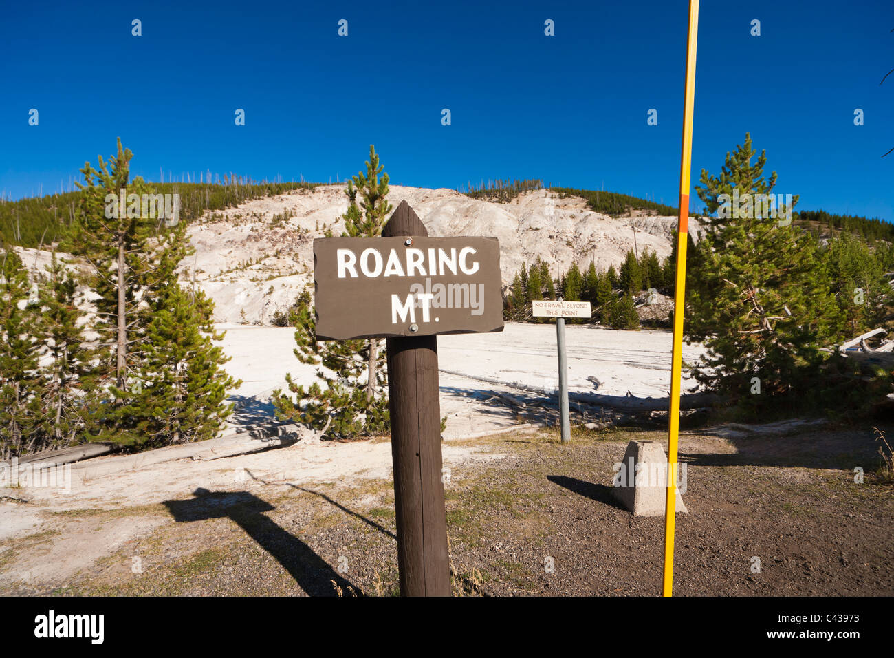 Roaring Mountain Yellowstone National Park signs and yardstick. Sign: no travel beyond this point. US Survey marker. Stock Photo