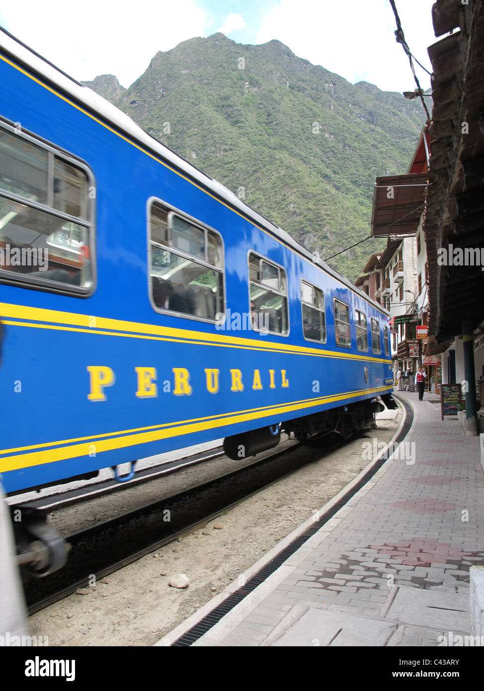 A train of Perurail passing Agua Calientes, near Machu Picchu, Peru Stock Photo