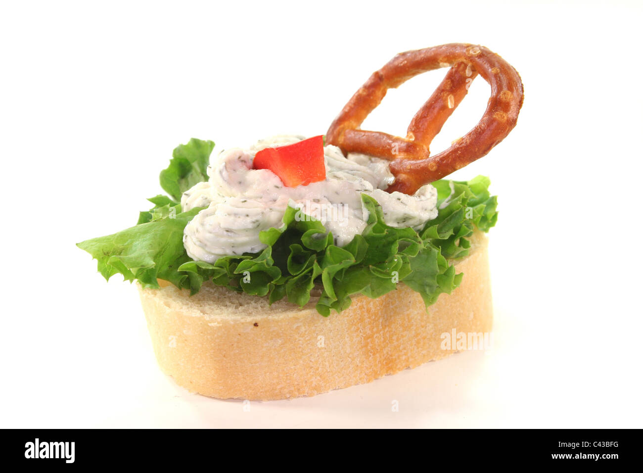 Canape with lettuce, cheese, peppers and a pretzel on a white background Stock Photo