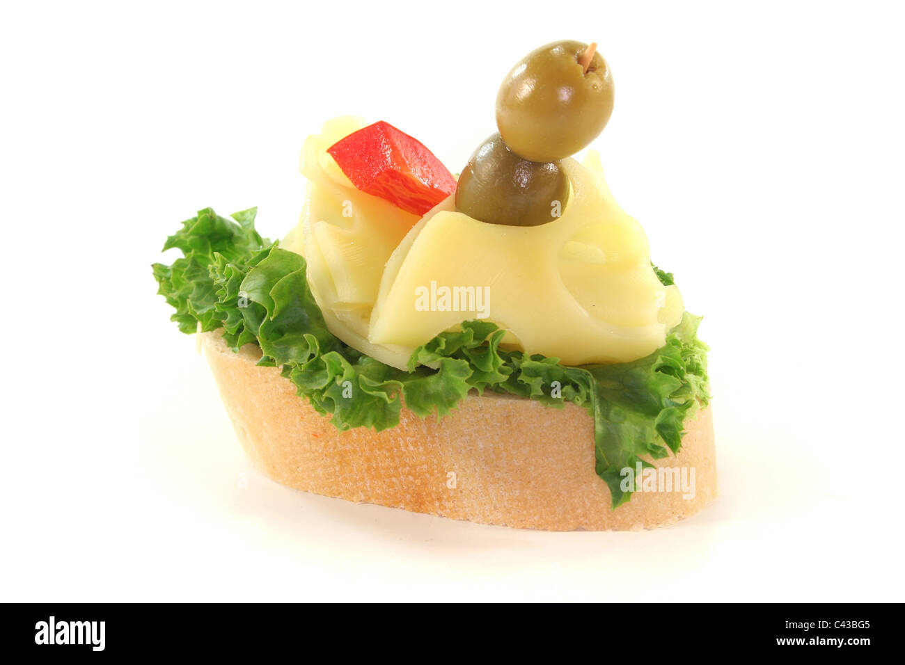 Canape with lettuce, cheese, peppers and olives on a white background Stock Photo